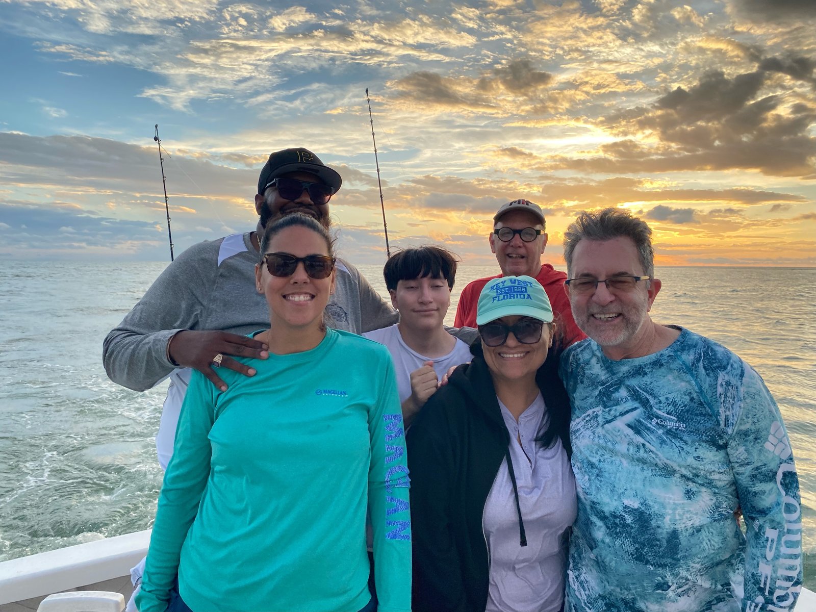 Six of us on the boat at sunset in Boca Grande