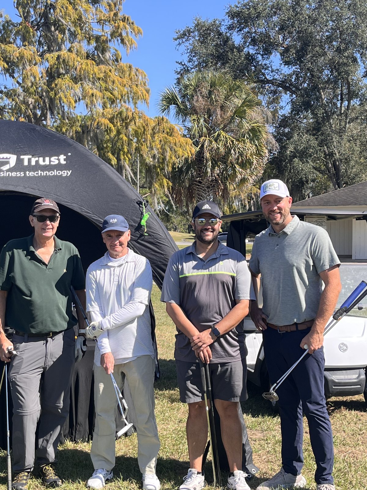 Four of our golfers under the Protected Trust tent
