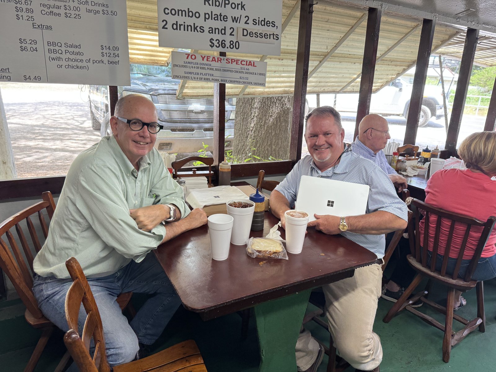 Rick Miles of Mulling Insurance Agency with the Surface he won, at lunch with Bill