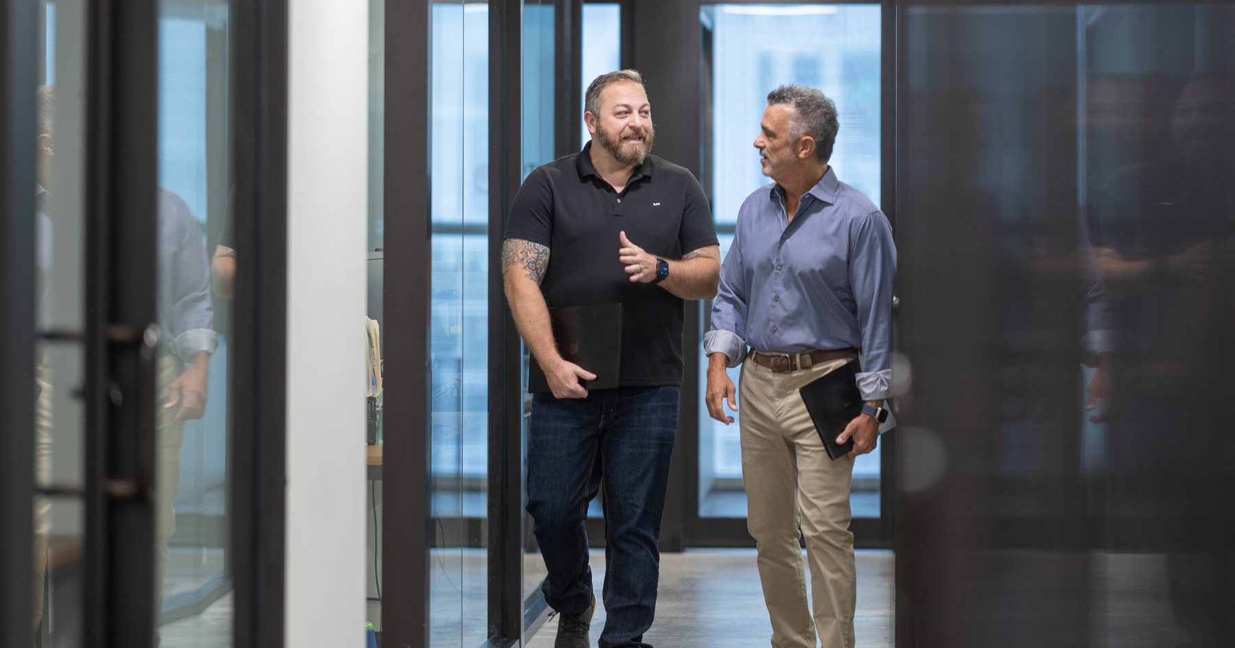 Three of the team at the corridor door
