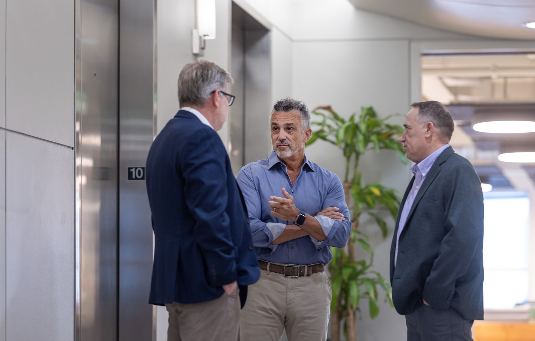 Three of the team by the elevators