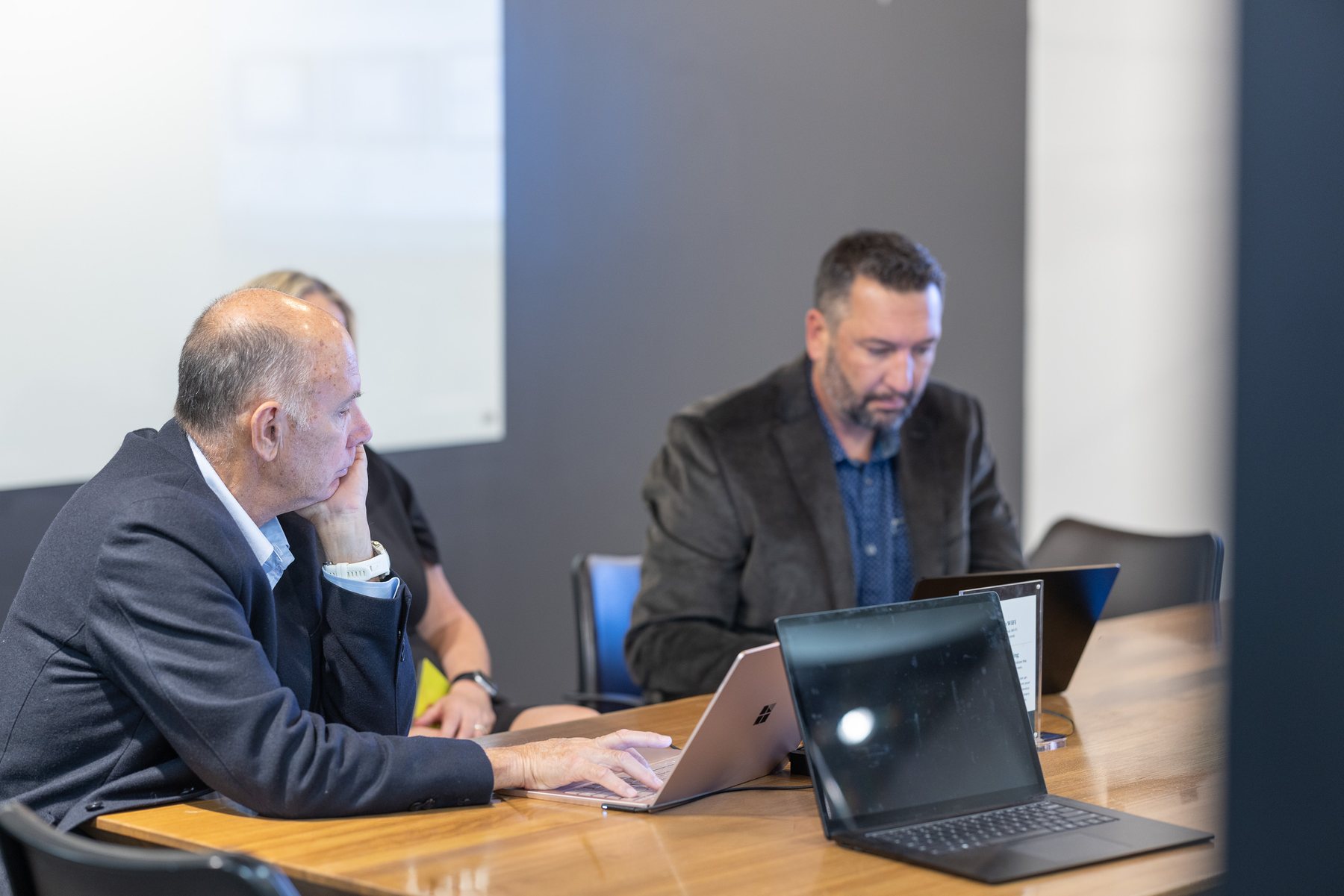 Two of the team planning at a table